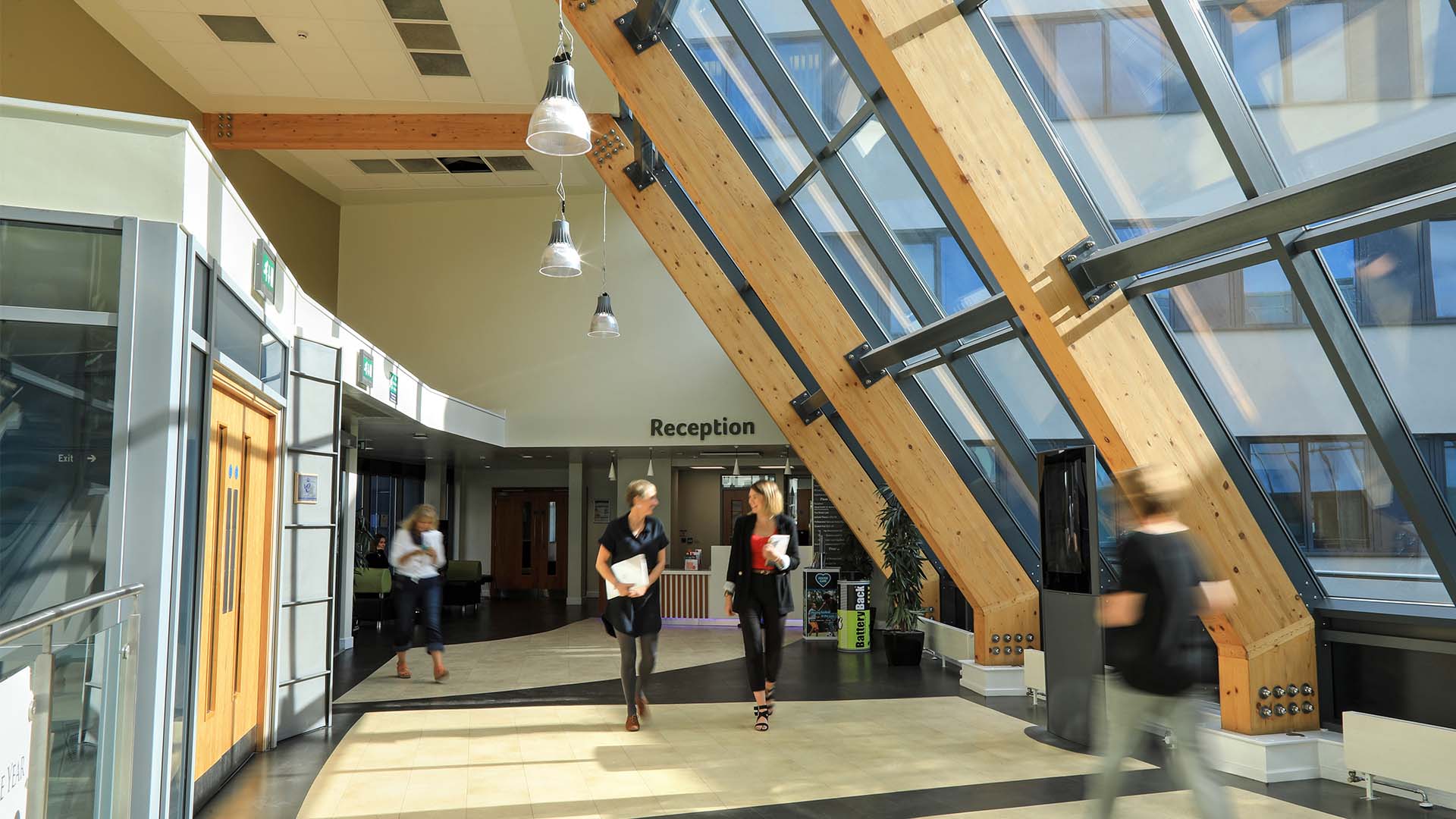 Students walking inside the Charles Sikes building