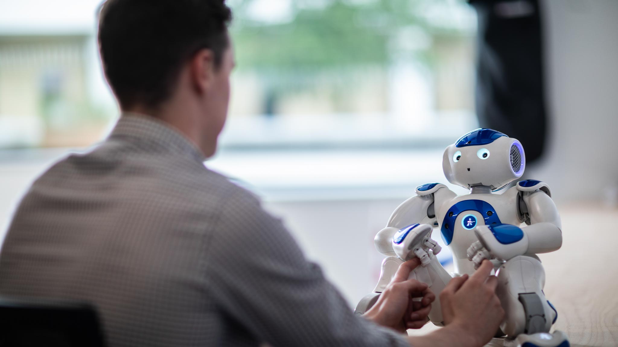 Student with a robot