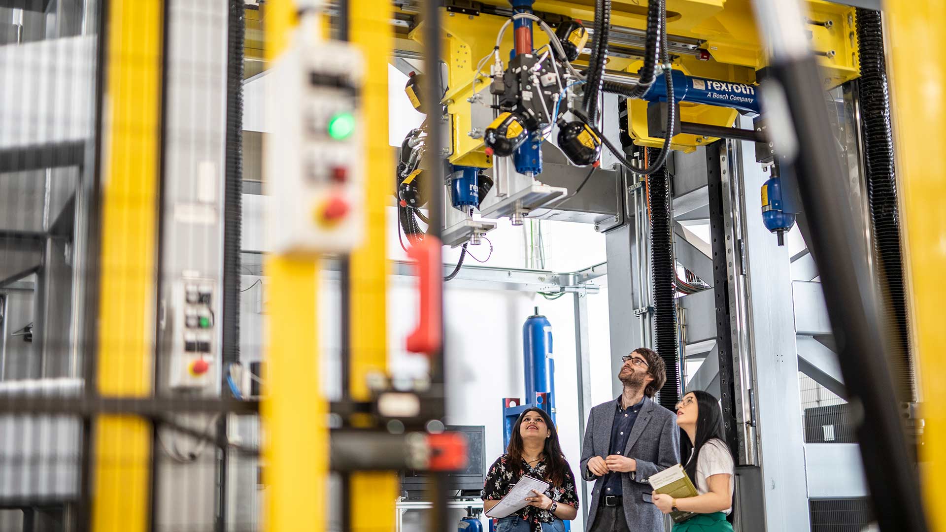 Students observing mechanical machinery