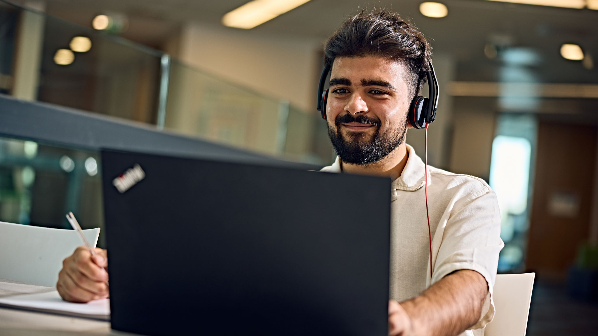 Student smiling with laptop