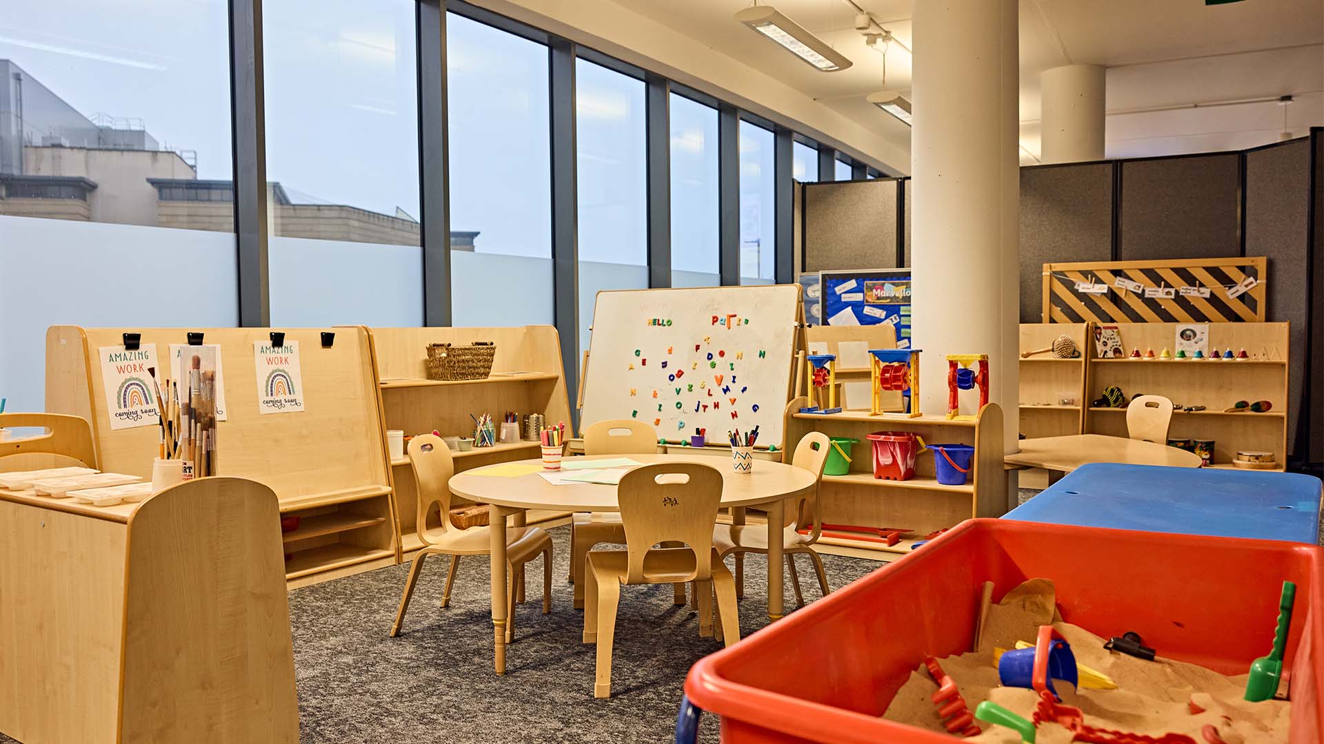 Primary Education classroom with paint and sandbox