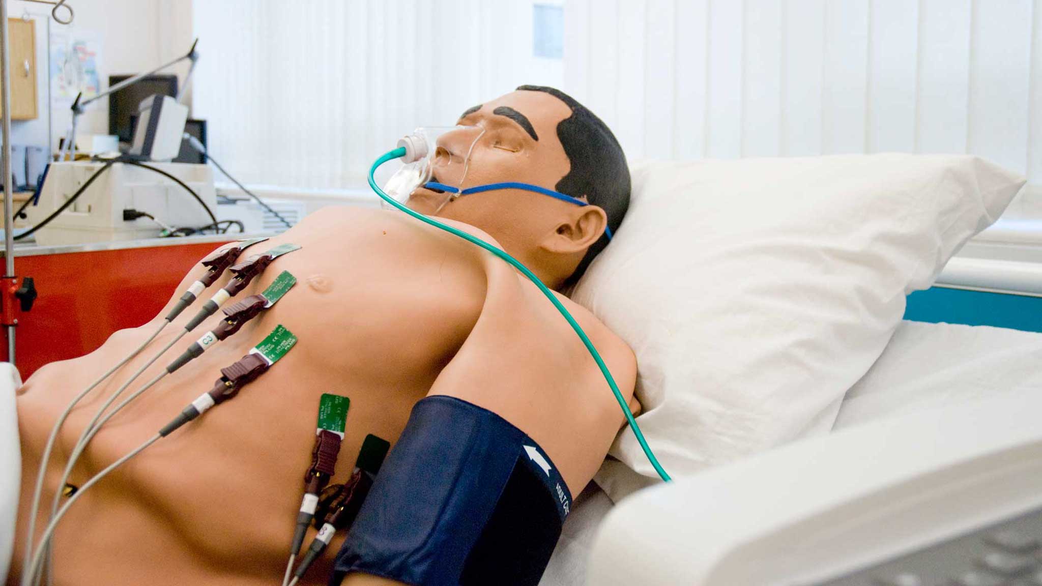 Image of a medical training dummy with wires attatched to it