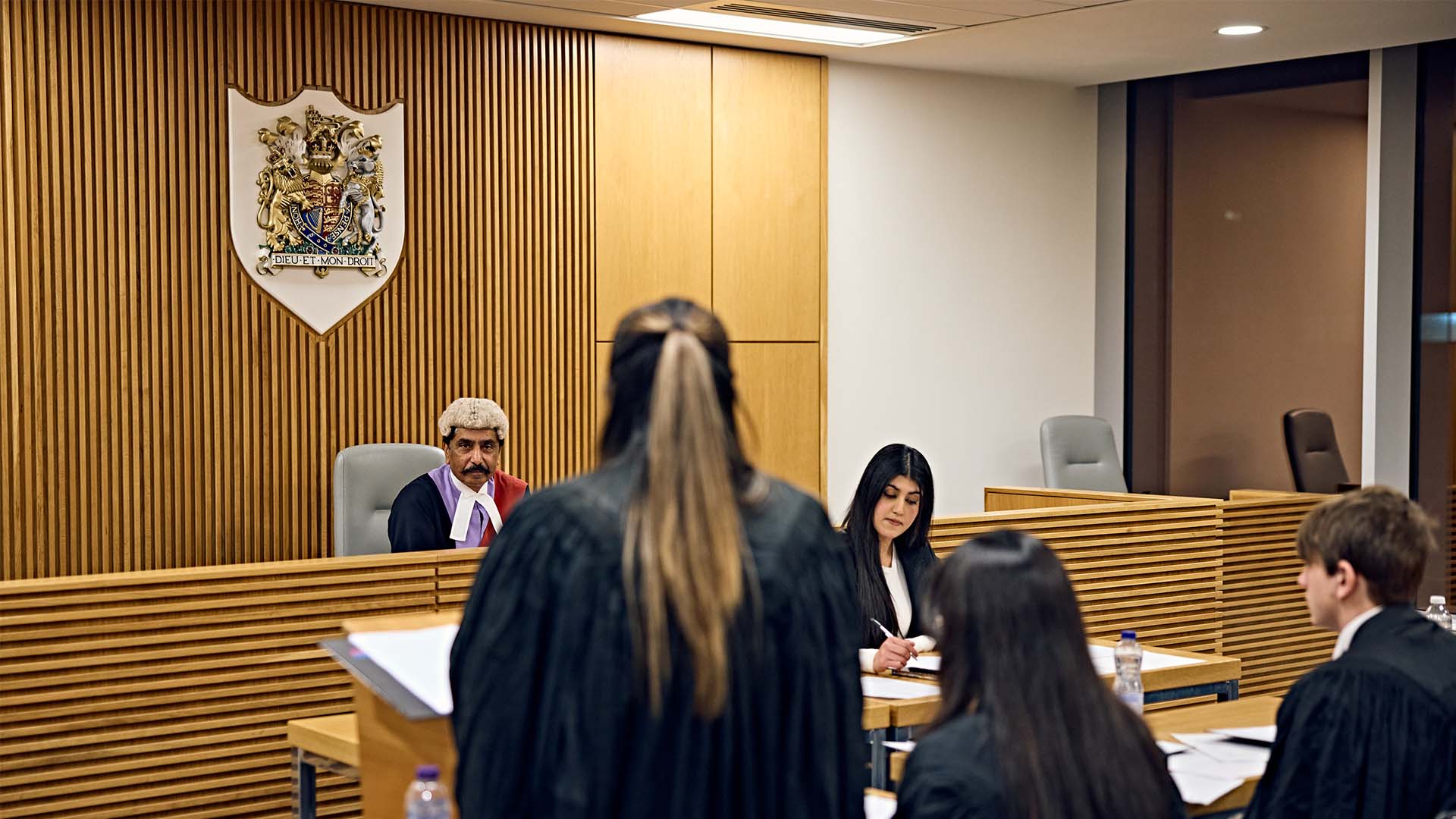 Students speaking in front of a judge
