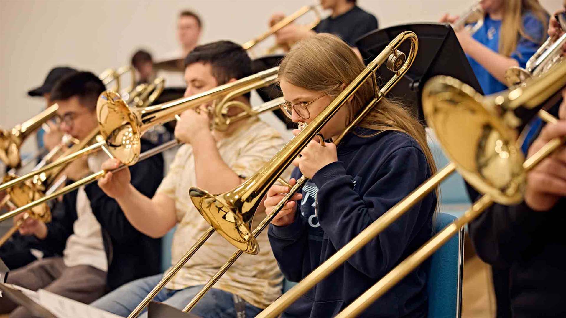 Music practice students playing brass instruments