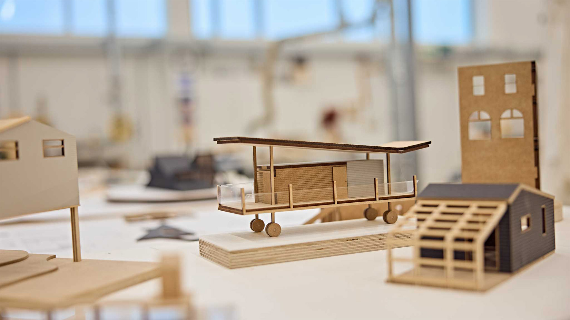 Wooden model of a home on wheels