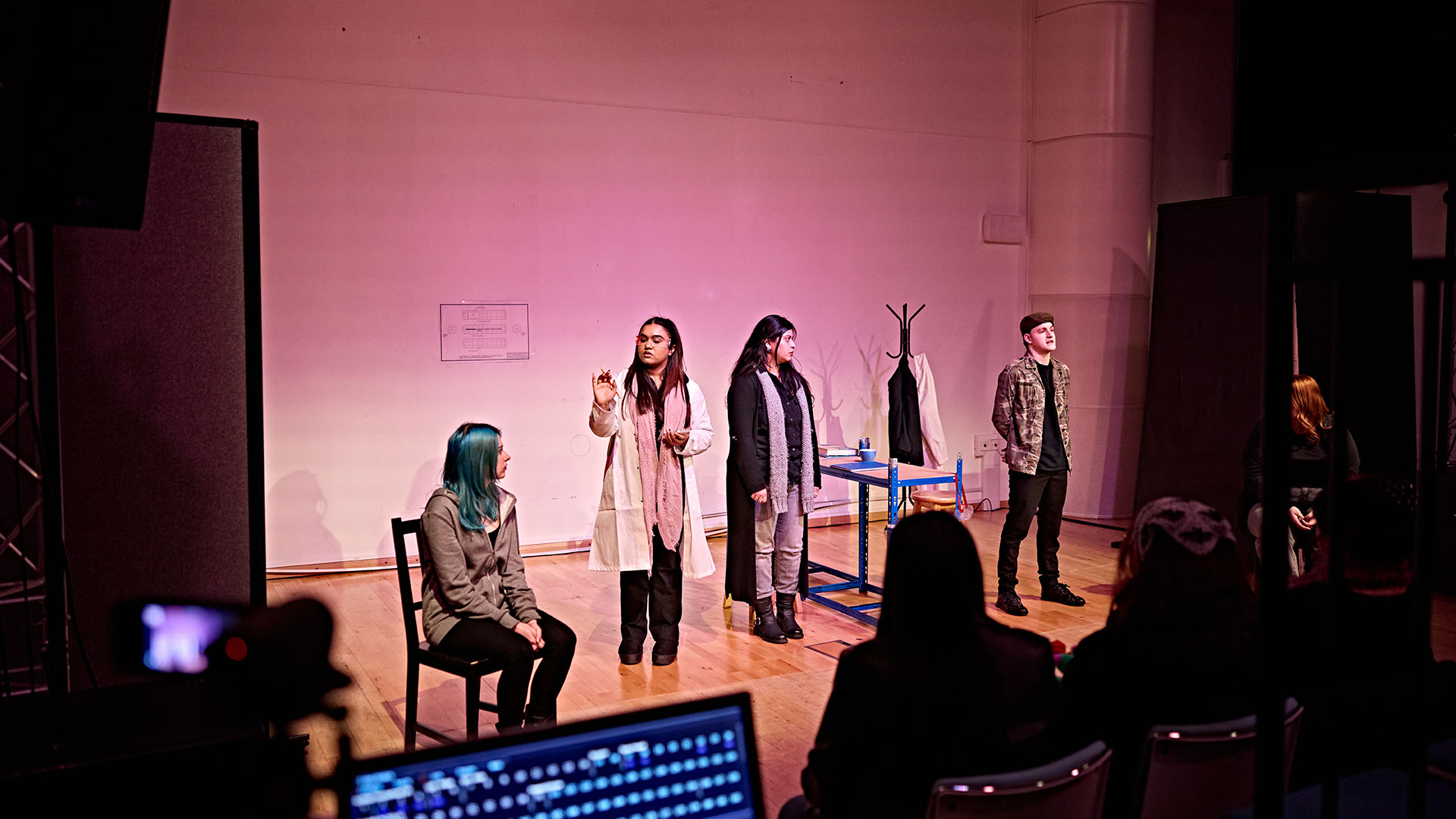 Student performance in art studio on stage