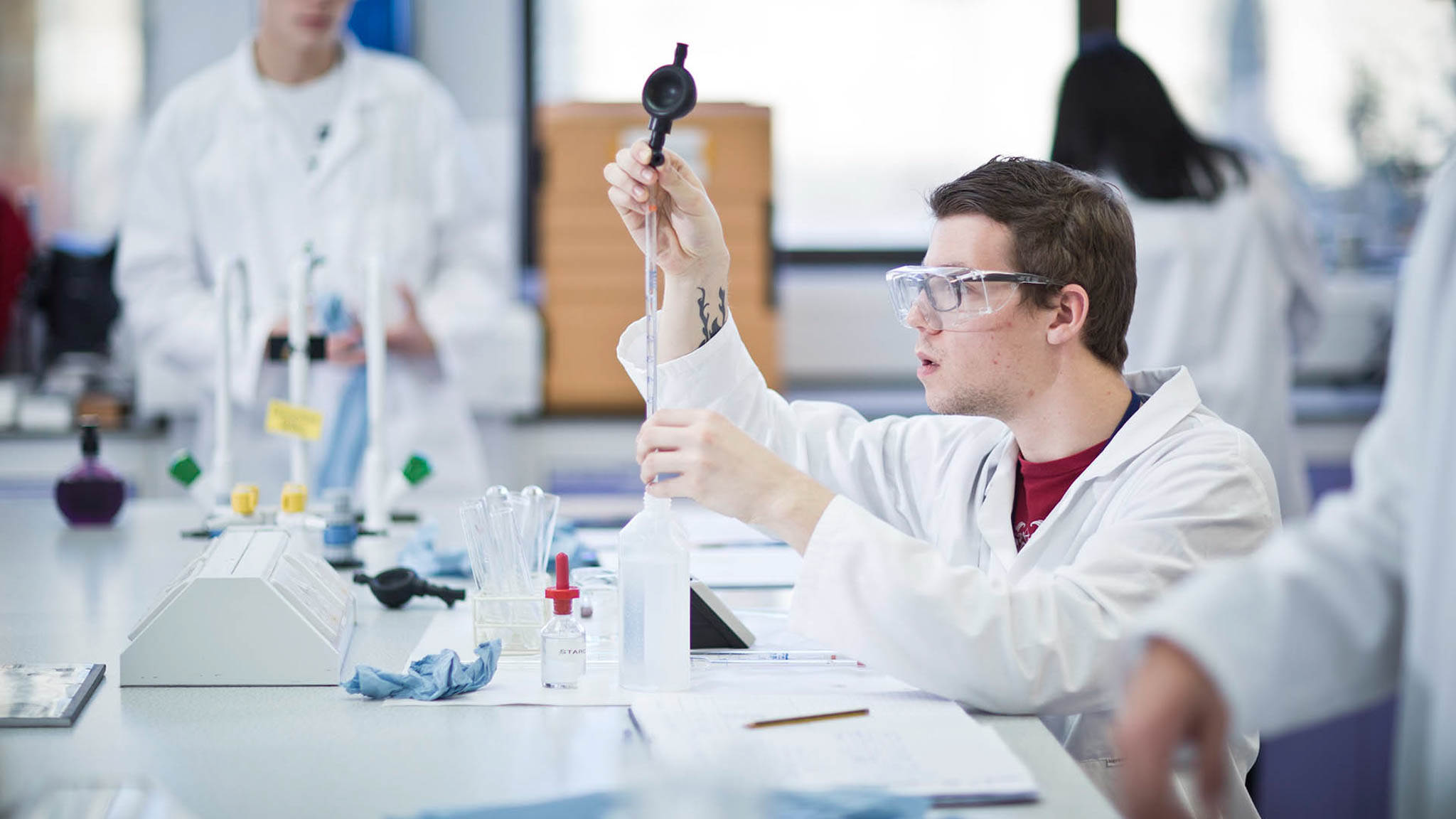 A man working on a chemistry project