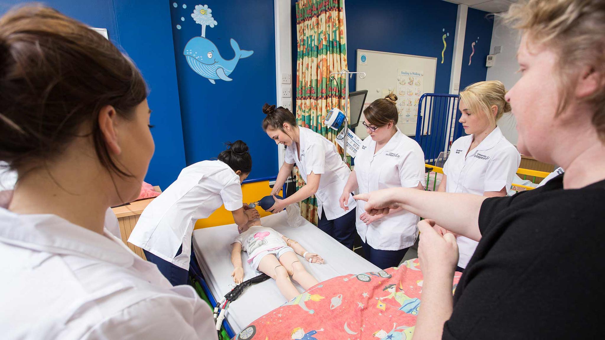 Simulated childrens ward, with students in clinical session