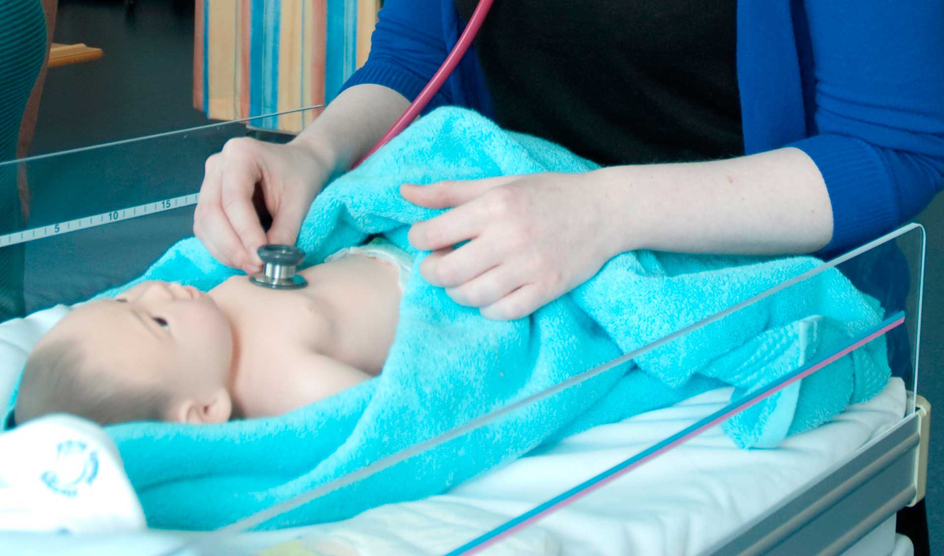 Listening to baby with stethoscope