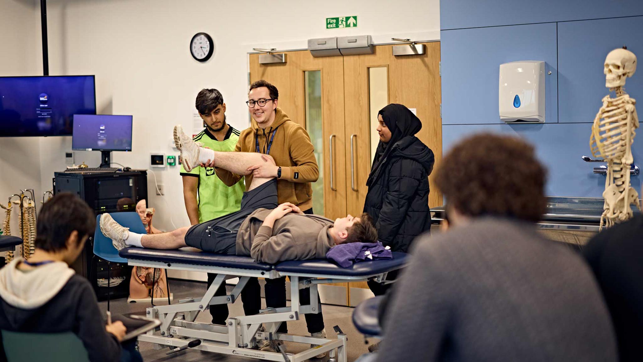 Lecturer demonstrating hip joint assessment skills